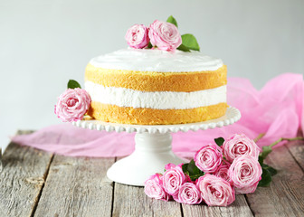 Obraz na płótnie Canvas Sweet cake on cake stand on grey wooden background