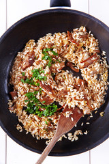 risotto with mushrooms in pan
