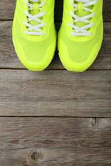 Pair of sport shoes on grey wooden background