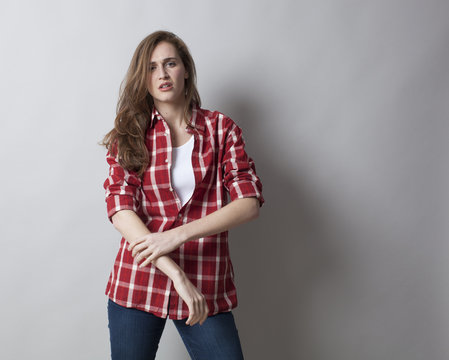 threatening woman with male shirt expressing self-assertion