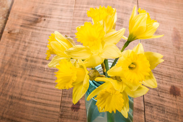 Bouquet of yellow daffodil flowers in a jar