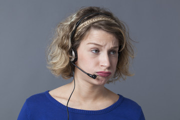 young fed up female professional working for a call center