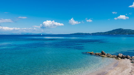 Golden sandy beach and Mediterranean sea near Agios Ioannis Peristeron, Corfu.