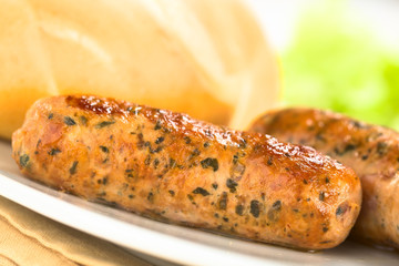 Fried bratwurst with bun, traditional German fast food