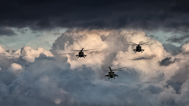 Group combat helicopters, Mi-24, Mi-8 on a background of clouds