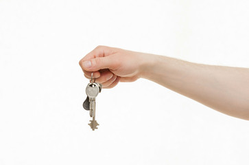 Man's hand holding a bunch of keys