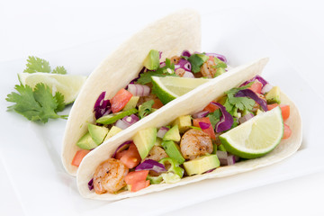 High resolution two spicy shrimp taco with avocado, tomato and red onion cilantro
