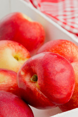 Whole white nectarines in crate