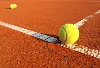 Tuinposter tennis ball on a tennis court © Željko Radojko