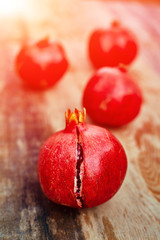 pomegranates on a dark wooden background
