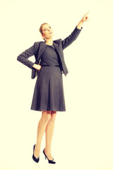 Businesswoman pointing high