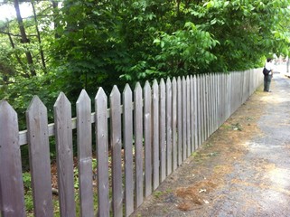 Wooden fence with man