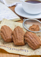 Cocoa powdered choco madeleines with a cup of coffee