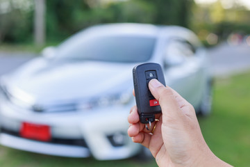 Woman hand holding key of new car