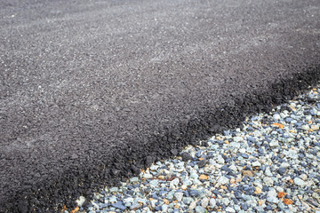Close up rock and new asphalt road texture