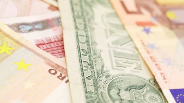 American dollar and euro banknotes - closeup