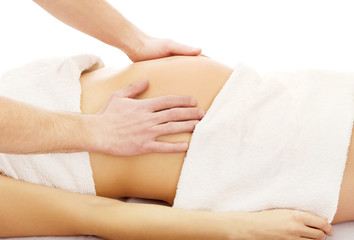 Fototapeta na wymiar Pregnant woman having a relaxing massage