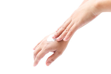 women applying hand cream to hands