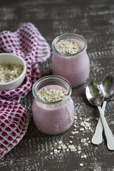 smoothie with strawberries and oat flakes in a glass jar 