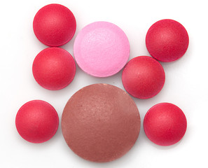 colored pills on white background