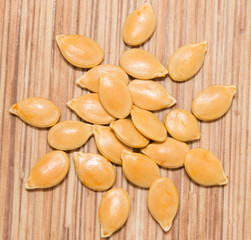 pumpkin seeds on a wooden background