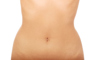 Fototapeta na wymiar Woman's slim belly.