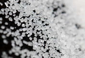 white sugar on a black background