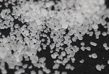white sugar on a black background