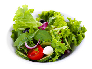 fresh vegetable salad in bowl isolated on white
