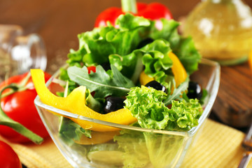 fresh vegetable salad in bowl on table close up