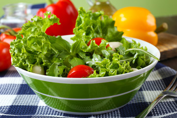 fresh vegetable salad in bowl on table close up