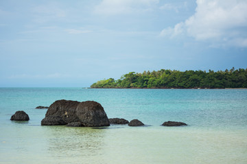 Blue sea with rocks on the beach