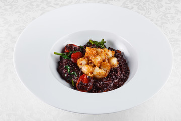 porridge made with wild rice and tomato