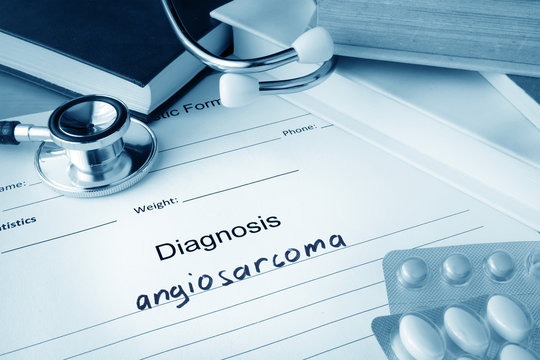 Diagnostic form with diagnosis angiosarcoma and pills.