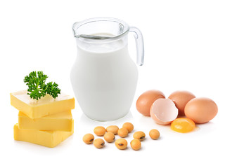 milk,soy beans,butter and egg on white background