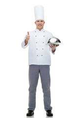 happy male chef cook with cloche showing thumbs up