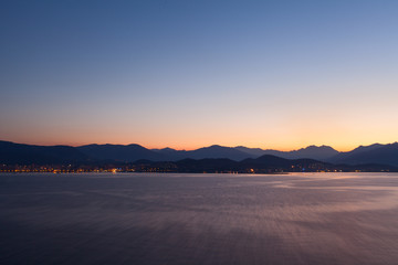 05 AM, coast of Corsica, France. Calm sea with first rays of sun