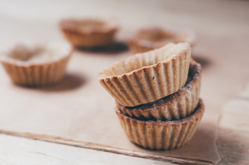 Little homemade oat tarts with whipped cream