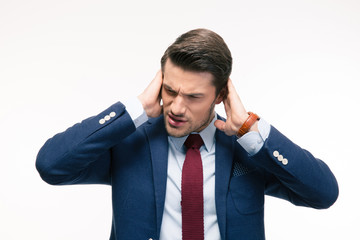 Businessman covering his ears