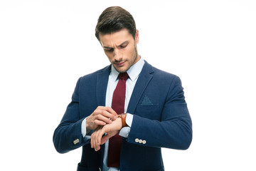 Handsome businessman looking on his wrist watch