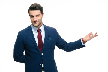 Businessman with arm out in a welcoming gesture