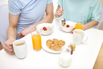 close up of couple having breakfast at home