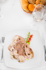 Delicious veal in white sauce in restaurant