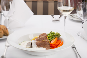 Delicious veal in white sauce in restaurant