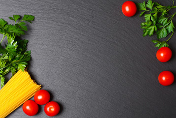 Raw pasta with tomatoes and parsley