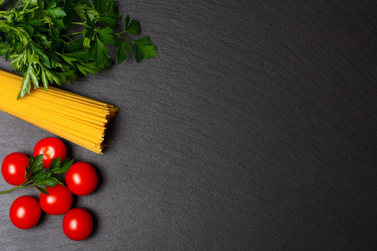 Raw pasta with tomatoes and parsley