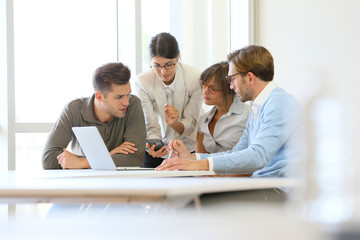 Business people meeting around table
