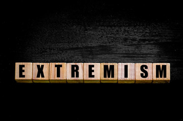 Word EXTREMISM isolated on black background