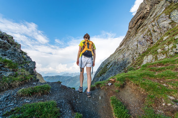 Naklejka premium Girl Alone exceeds mountain pass
