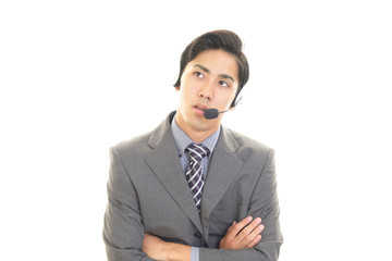 疲れた表情のオペレーター